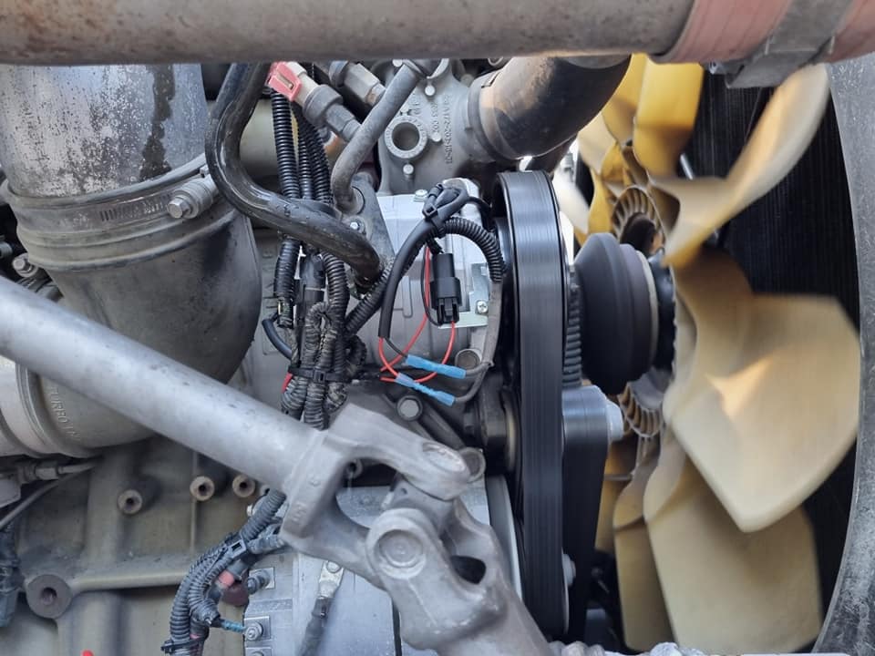 A Close Up Of A Car Engine With A Fan Attached To It — B & W Commercials In Wauchope, NSW