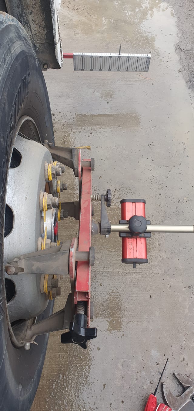A Truck Wheel Is Being Aligned With A Machine — B & W Commercials In Wauchope, NSW