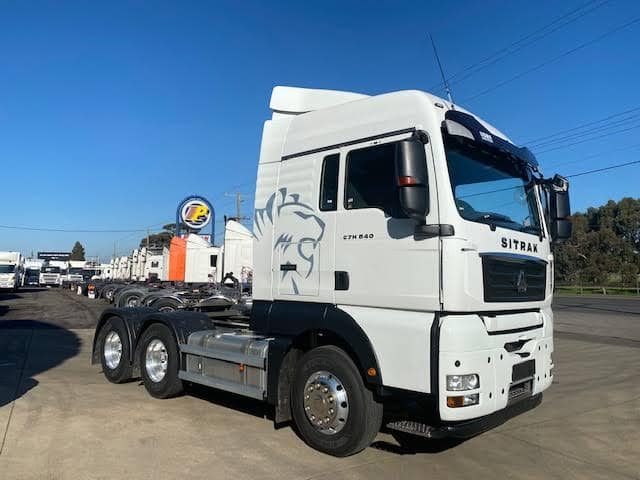 A White Semi Truck Is Parked In A Parking Lot — B & W Commercials In Wauchope, NSW