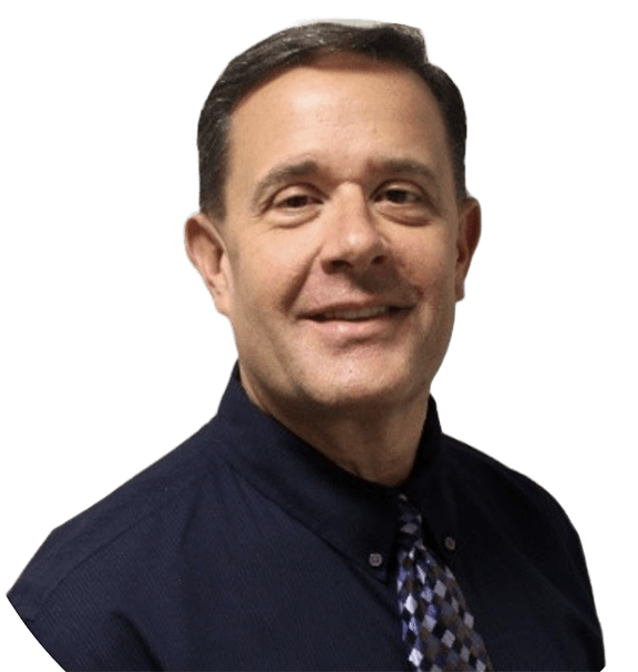 A man wearing a blue shirt and tie smiles for the camera