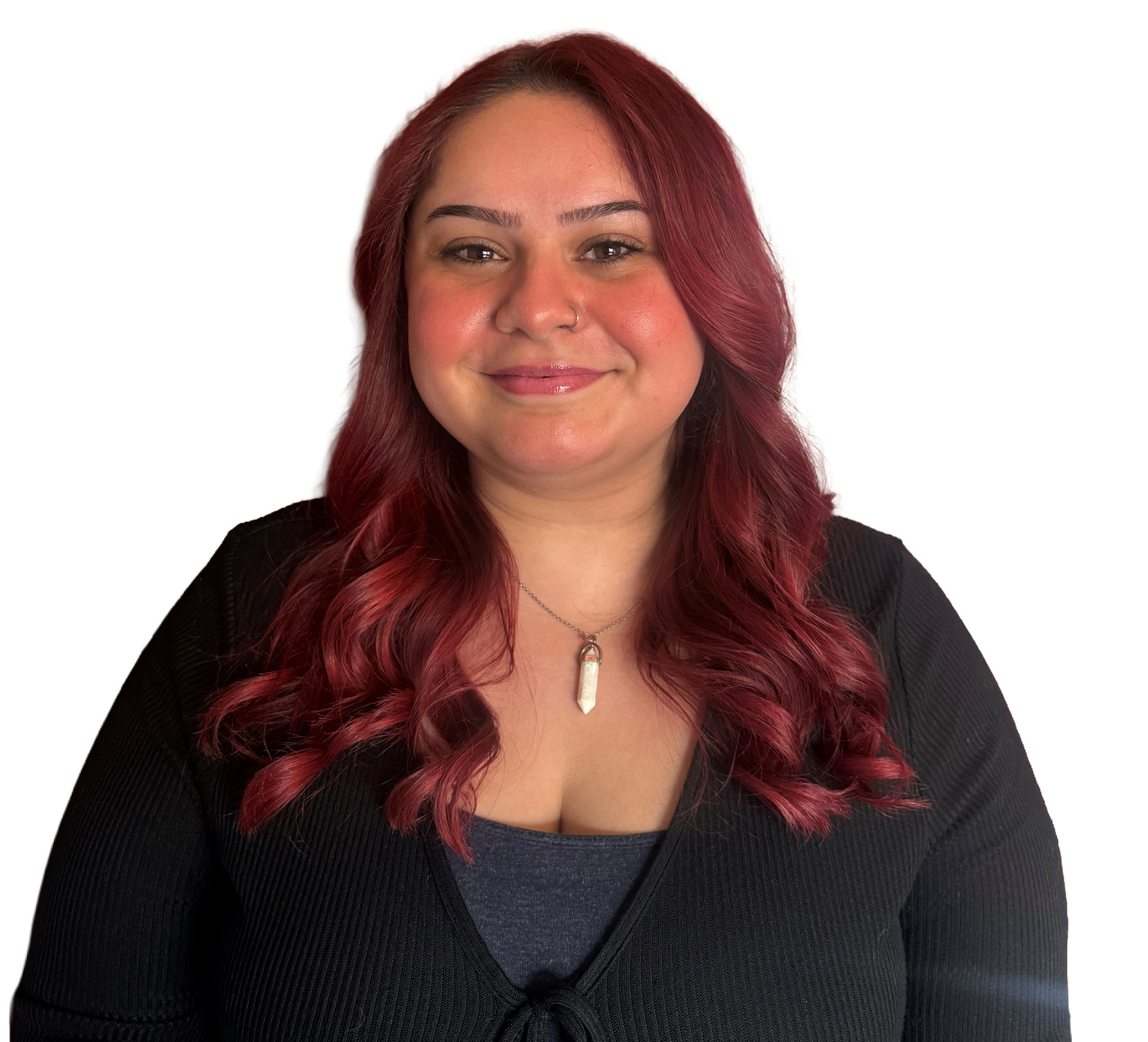 A woman in a black lace top smiles for the camera