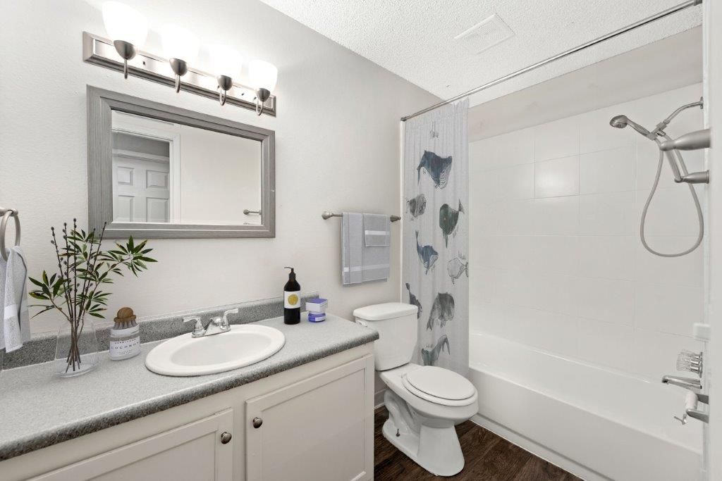 bathroom photo showing shower with adjustable showerhead