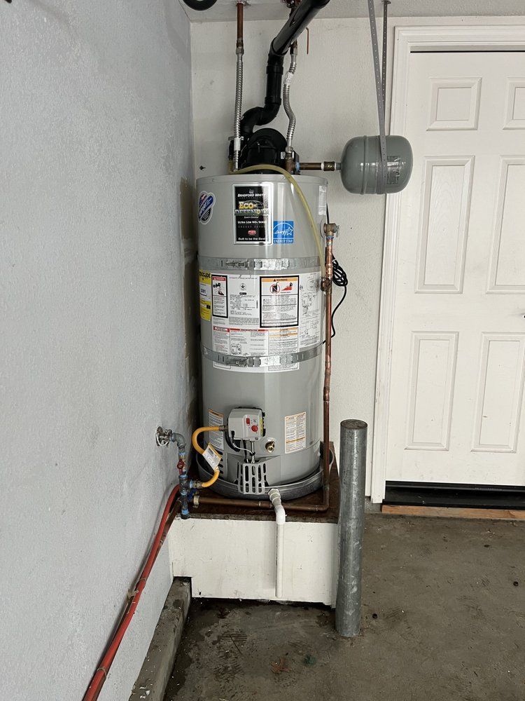 A water heater with a warning label on it