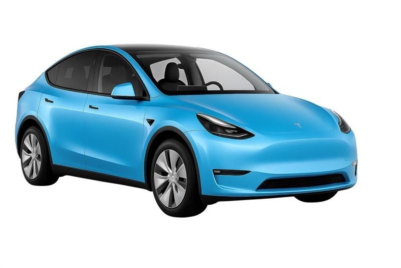 Car being wrapped in clear protective film, in a brightly lit garage.