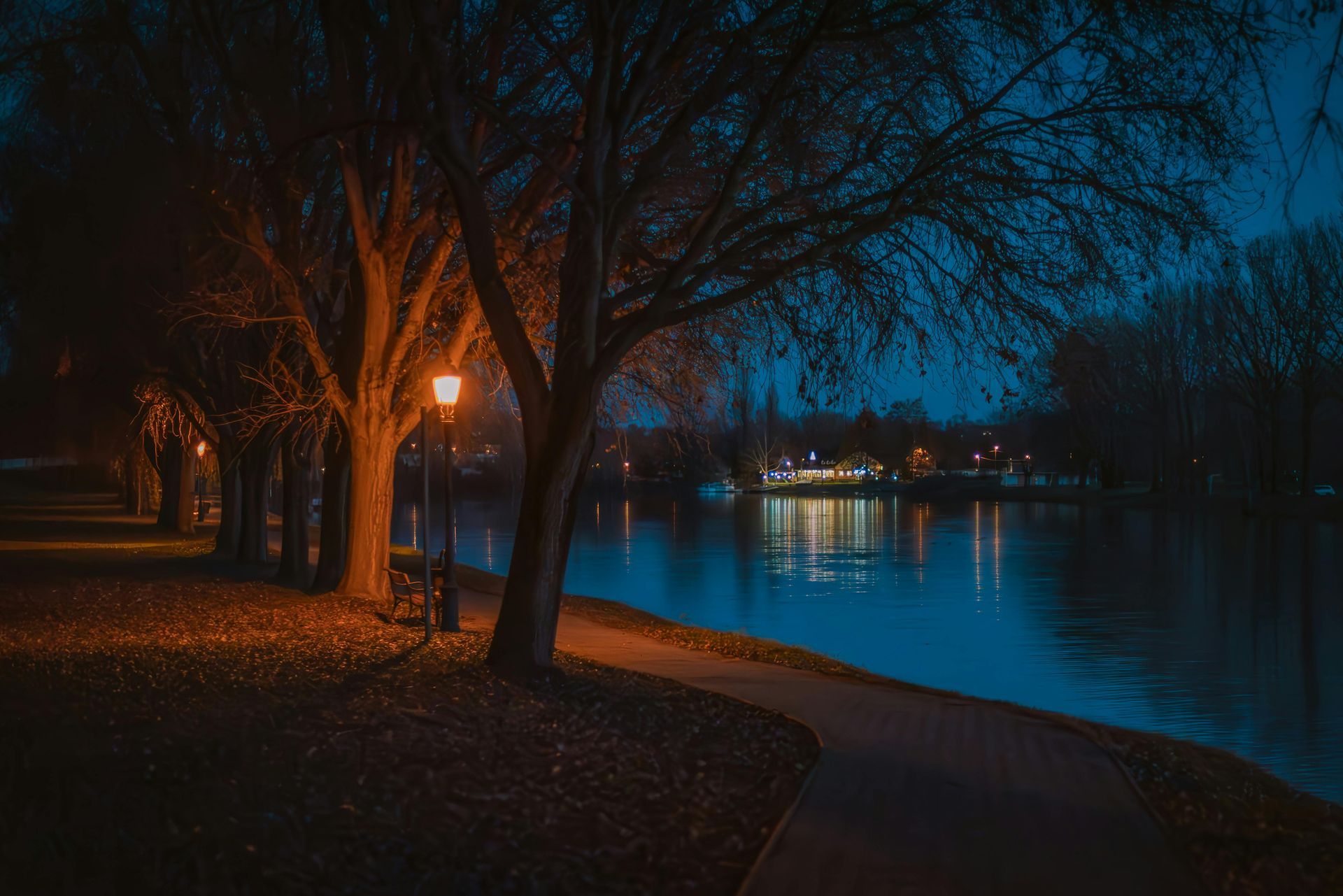 Illuminated address marker with the number 5270 on a stone base surrounded by rocks.