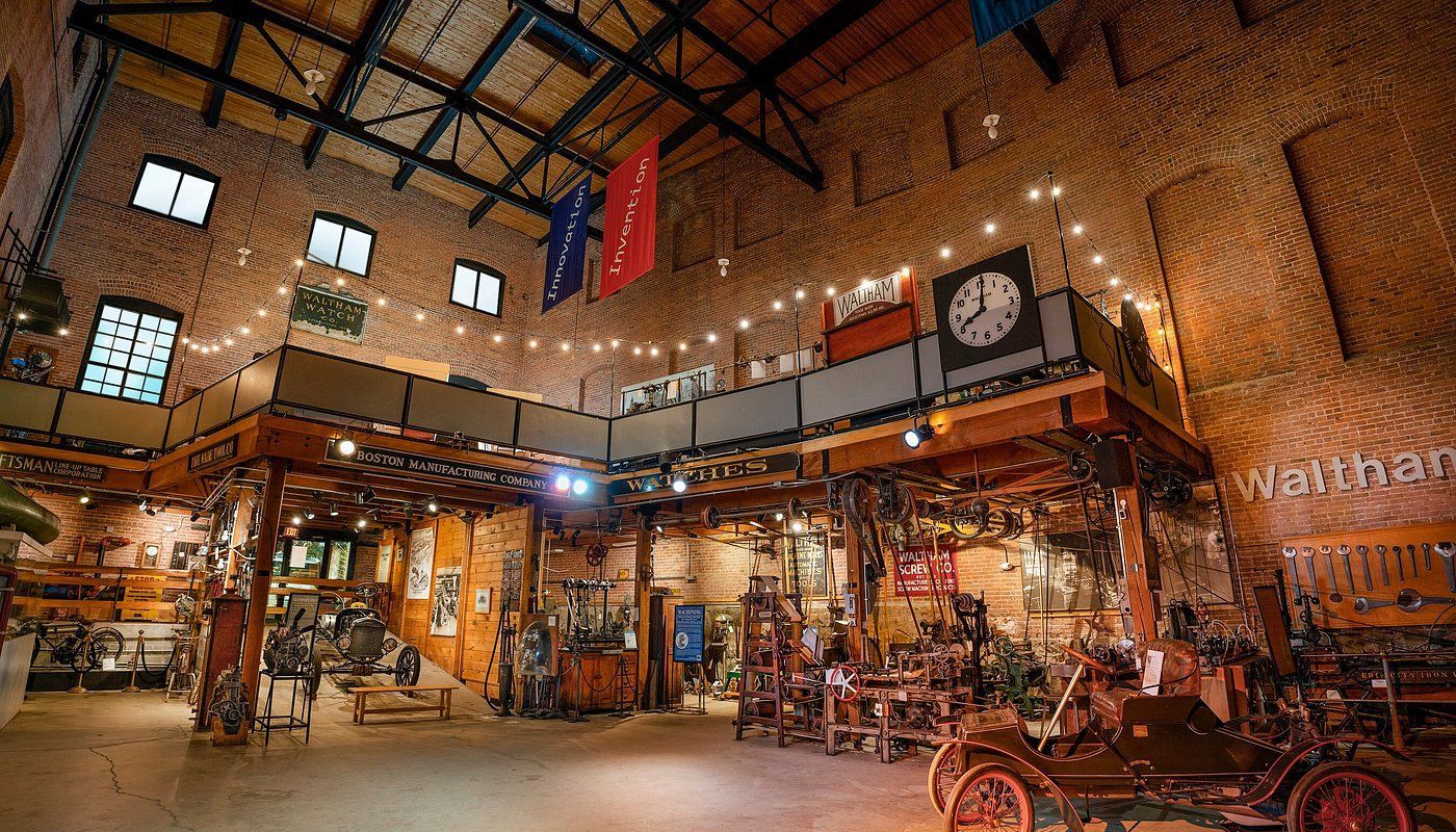 A large room with a lot of furniture and a clock on the wall.