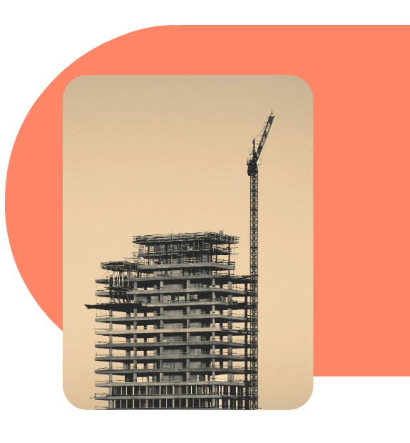 A building under construction with a crane on top of it.