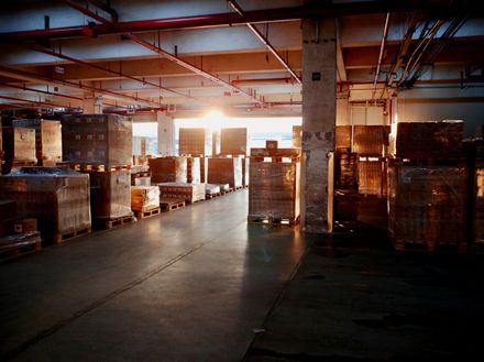 A warehouse filled with lots of boxes and pallets