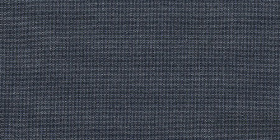 A close up of a blue fabric with a checkered pattern.