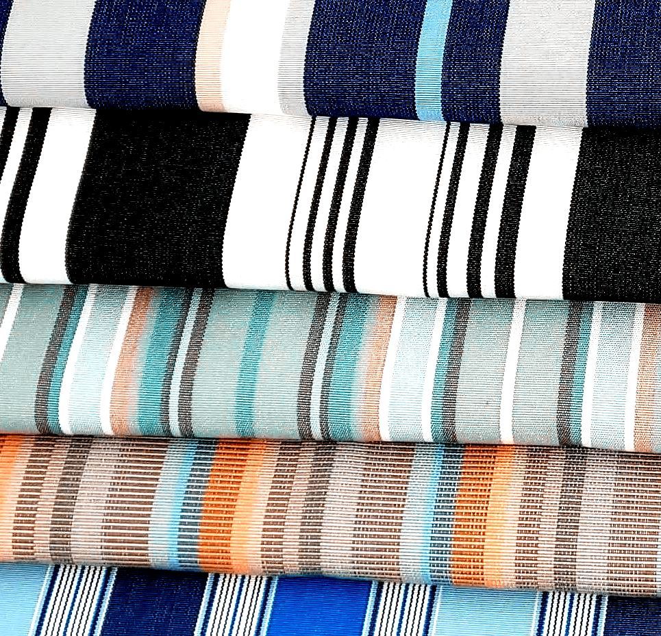 A stack of folder cushion fabrics showing different cushion fabric designs and color options