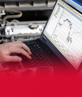 Man performing digital inspections on laptop | Tveten's Auto Clinic