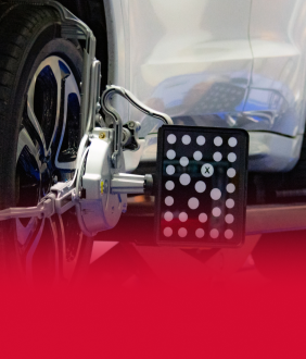 Up close of device for wheel alignment | Tveten's Auto Clinic