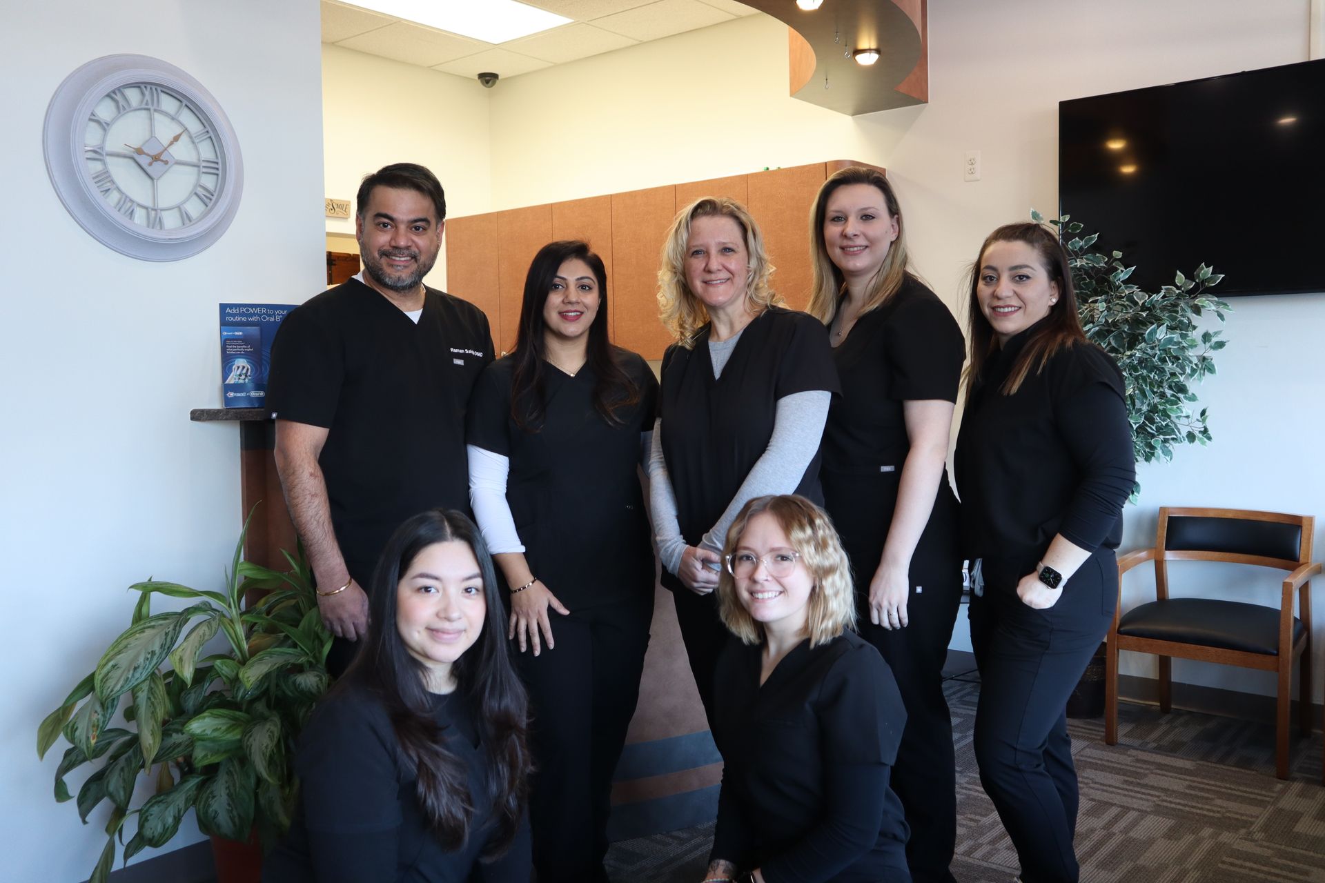 the dental team at Art Dentistry Center standing in the lobby of the practice.