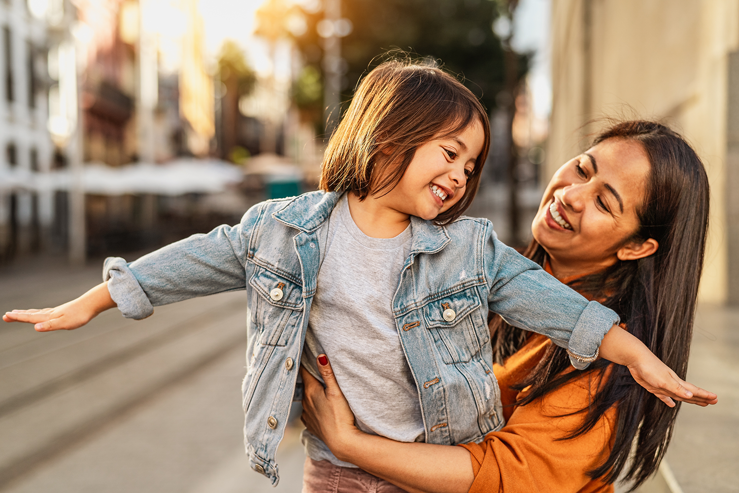 women and child happy and smiling outdoors