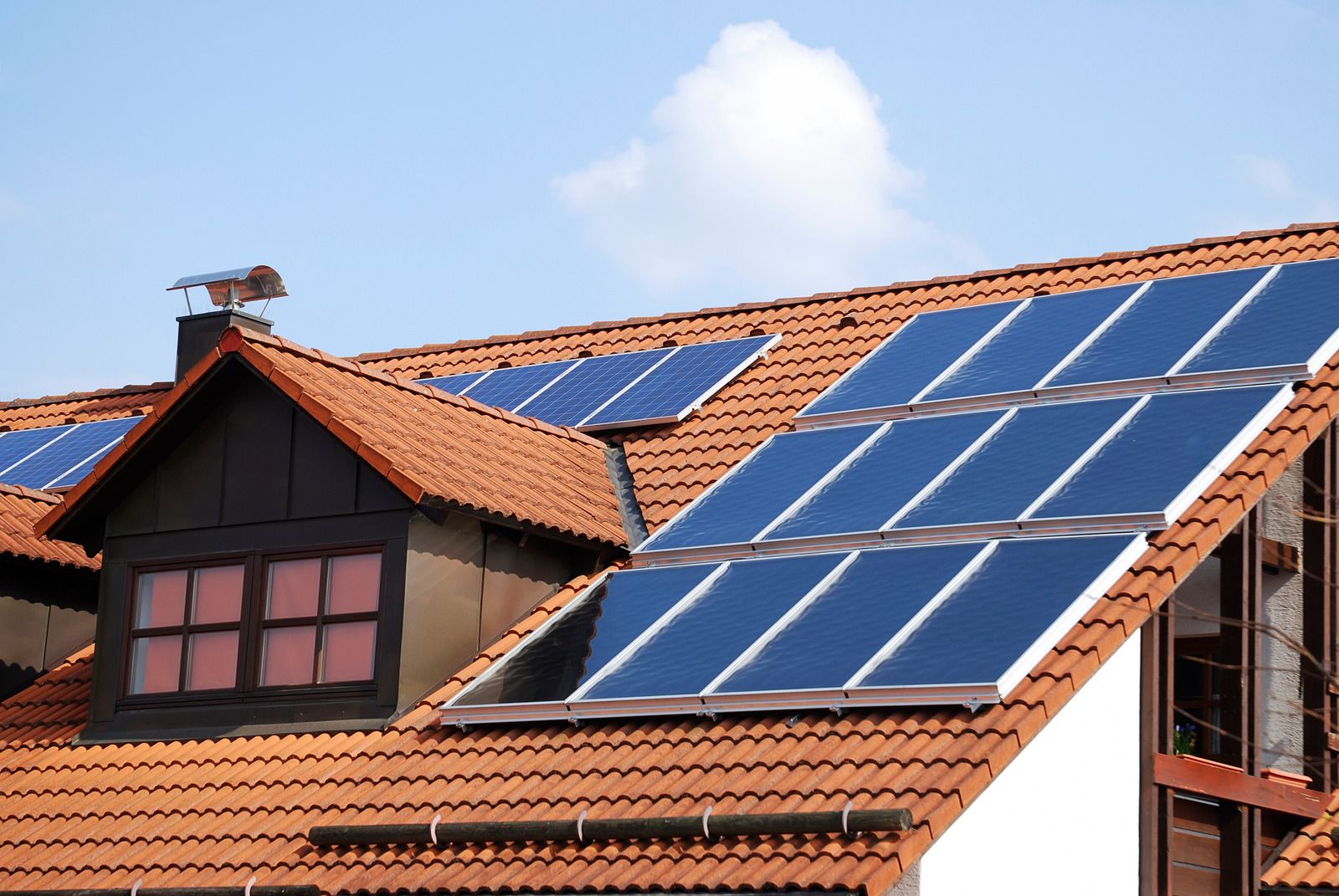 A roof with a lot of solar panels on it