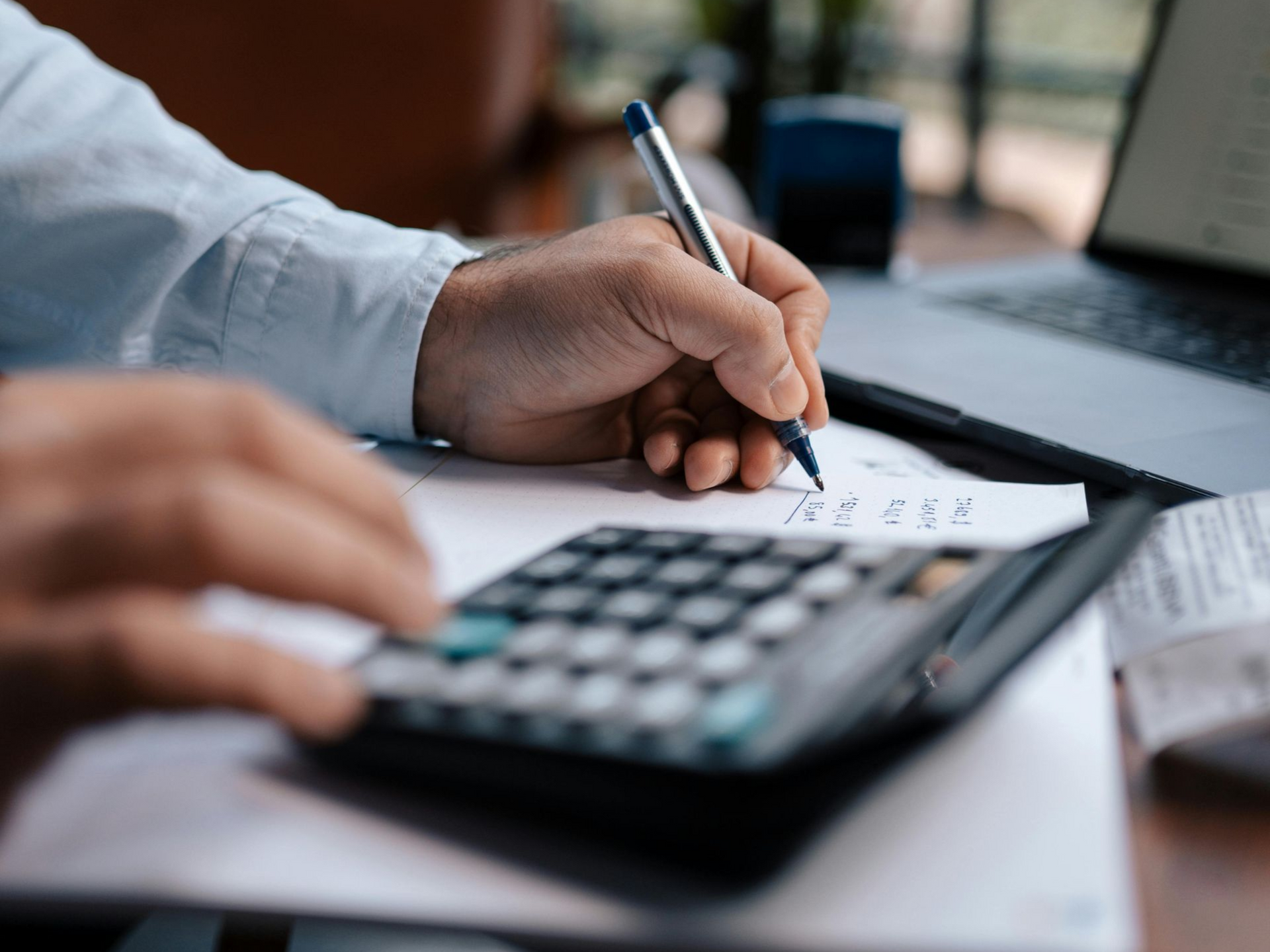 Solar panel carport shading a white SUV in a parking lot in Treasure Valley ready to be cleaned by Noble Clean, a professional cleaning services