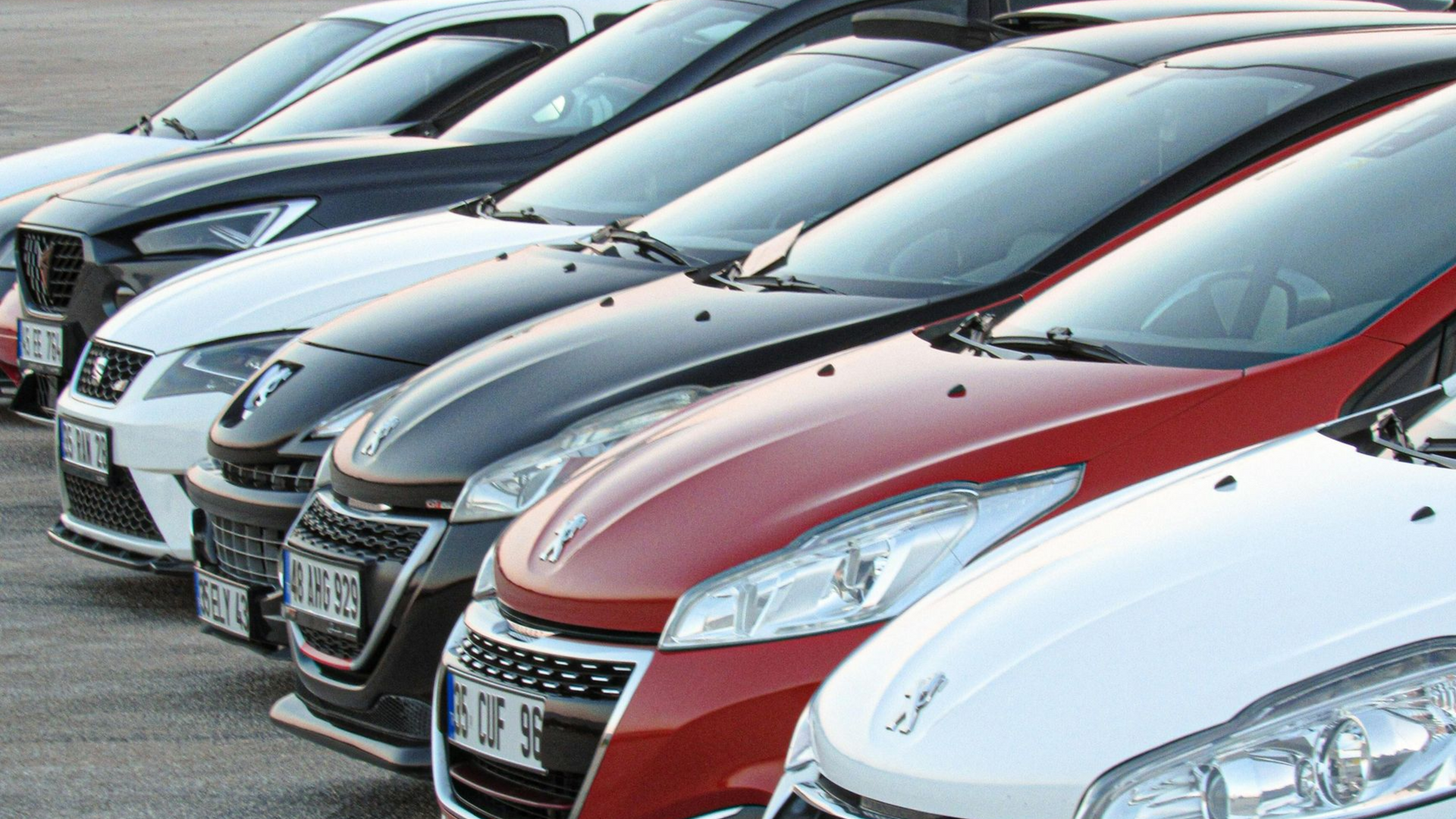Black SUV parked in a Eagle's parking garage, near concrete pillars and metal netting to be cleaned at Noble Cleaning a cleaning and janitorial services