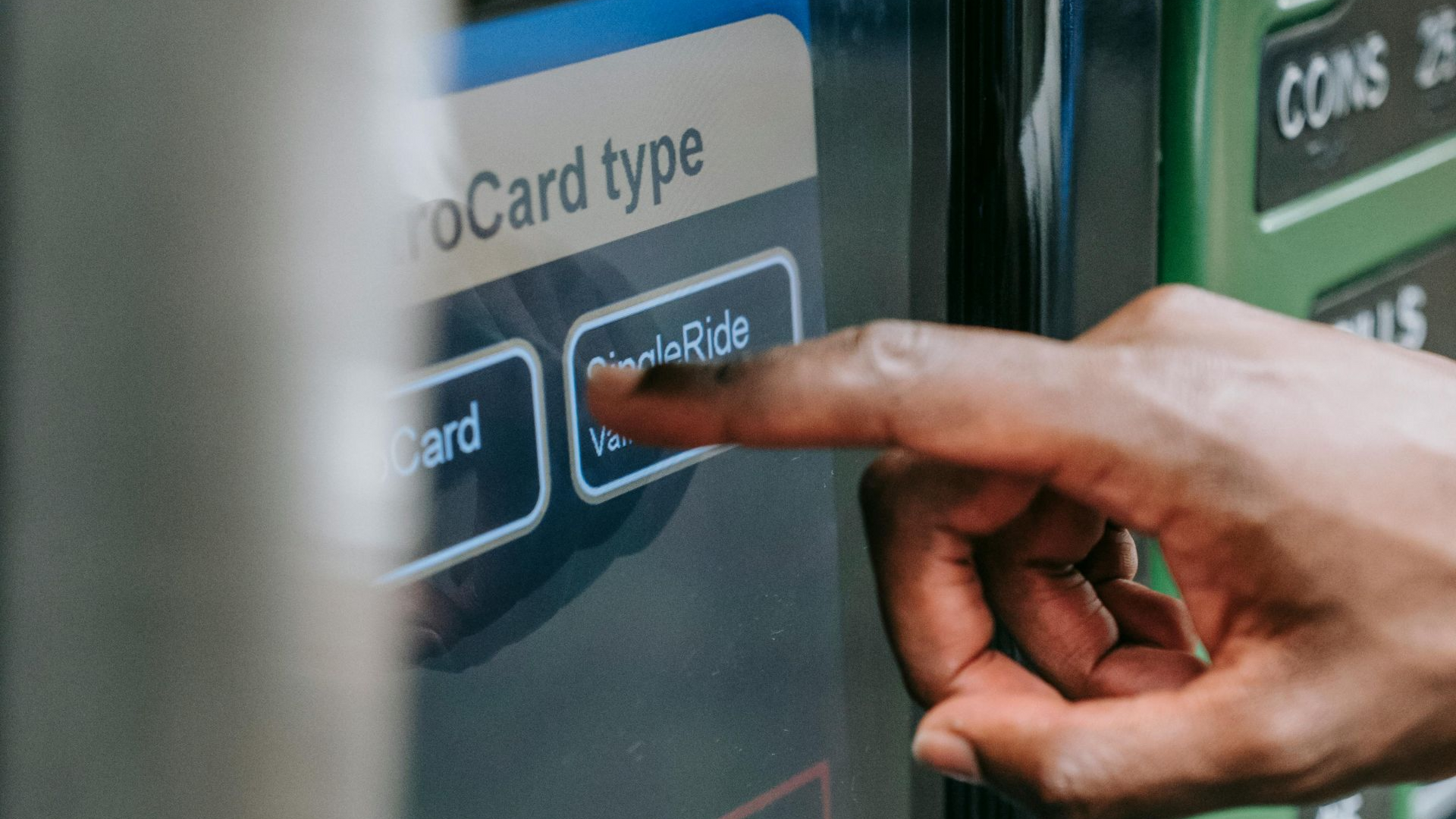 A white vehicle in Treasure Valley covered in thick foam cleaned well by Noble Clean in front of a metal wall; the windshield wipers are visible.