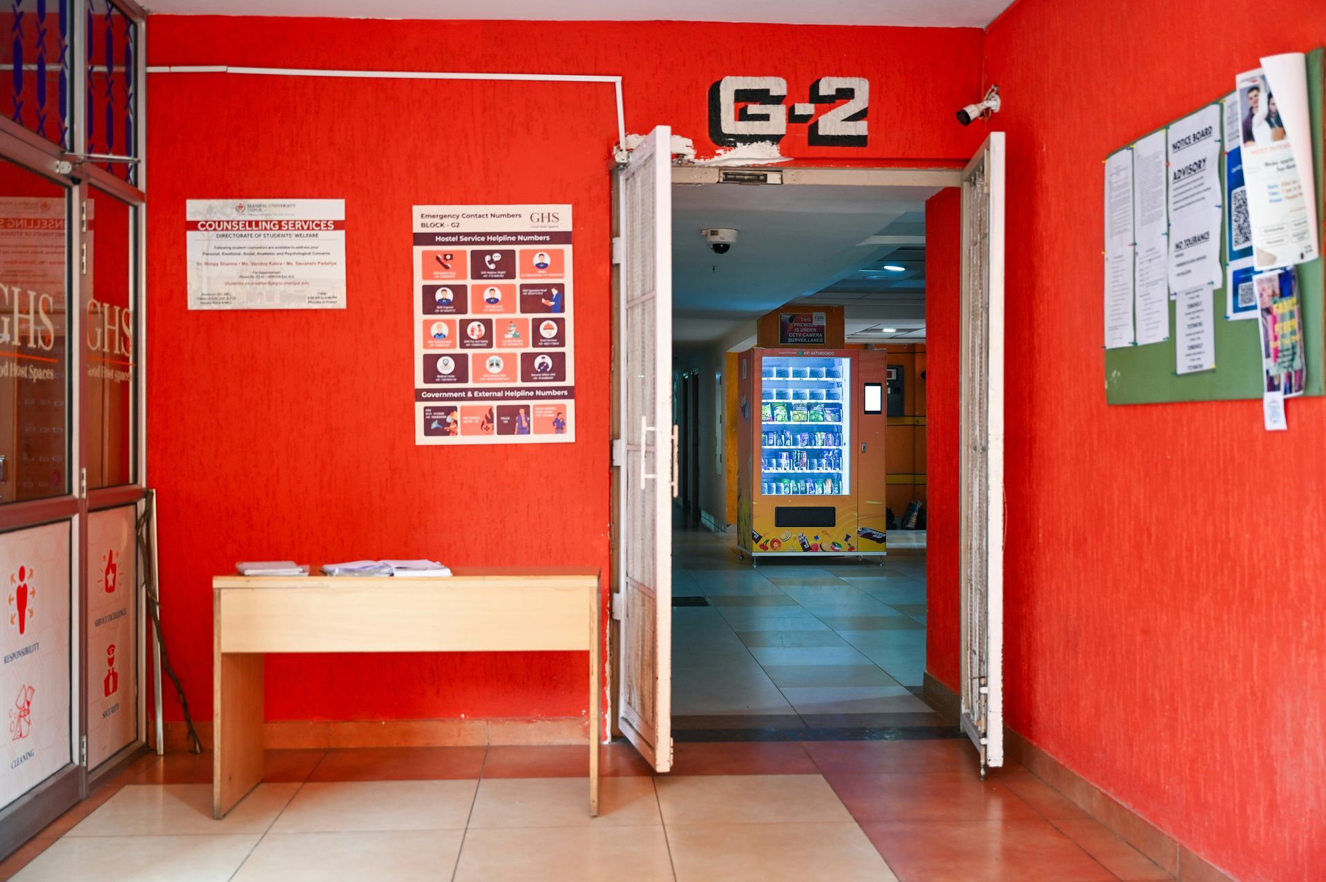 Red hallway with door to 