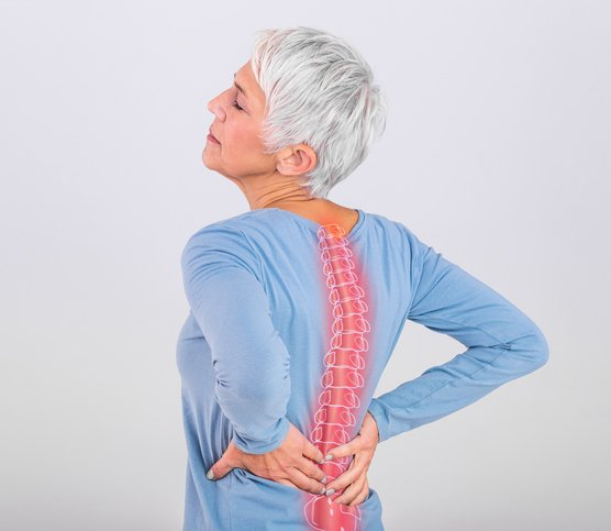 Woman Suffering Back Pain | Albany, NY | Capital District Interventional Spine & Rehabilitation PLLC