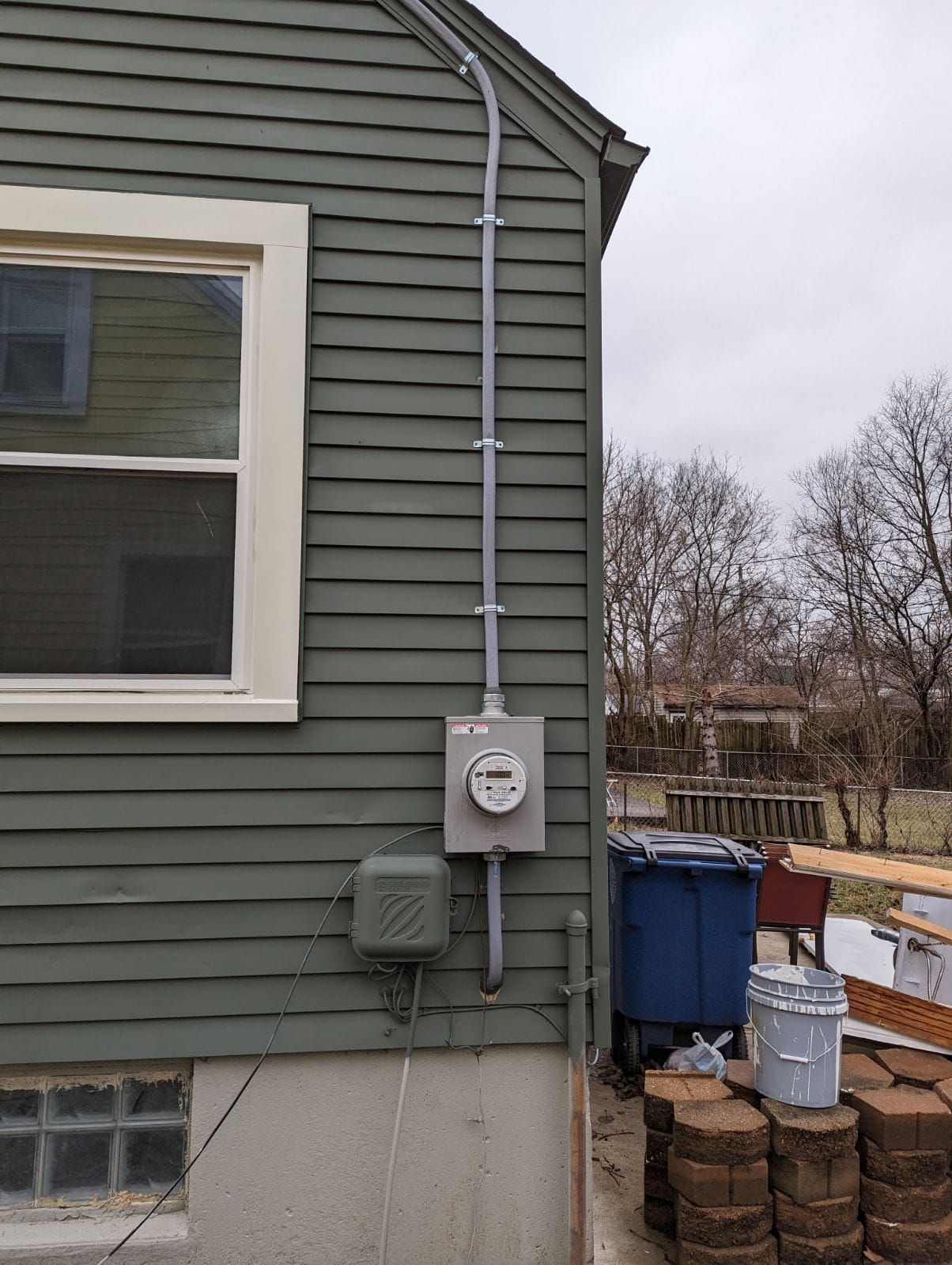 A house with a meter on the side of it