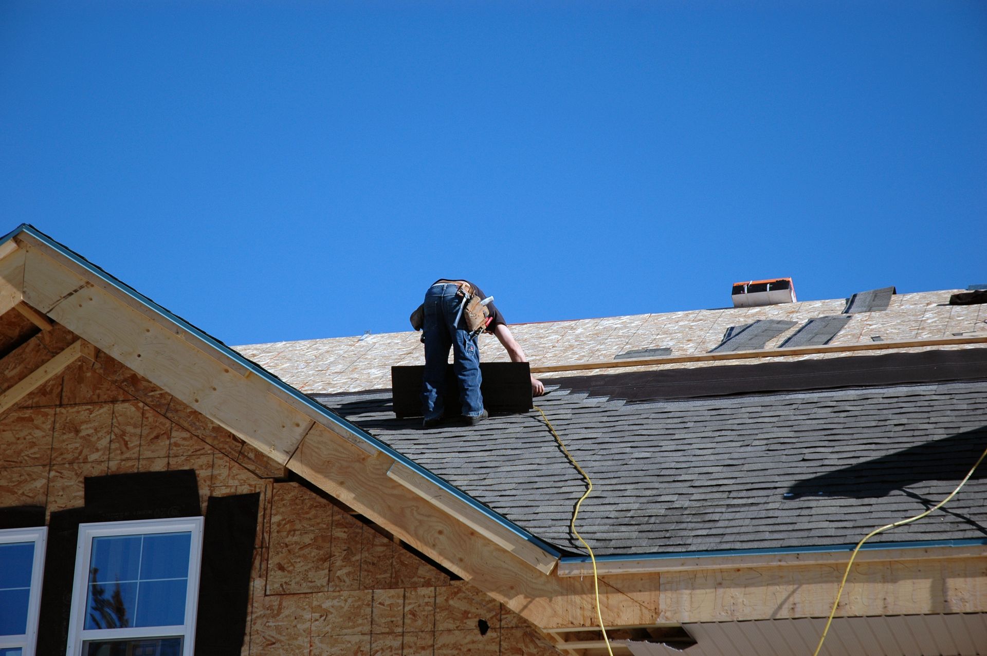 a roofer doing a roofing repair services