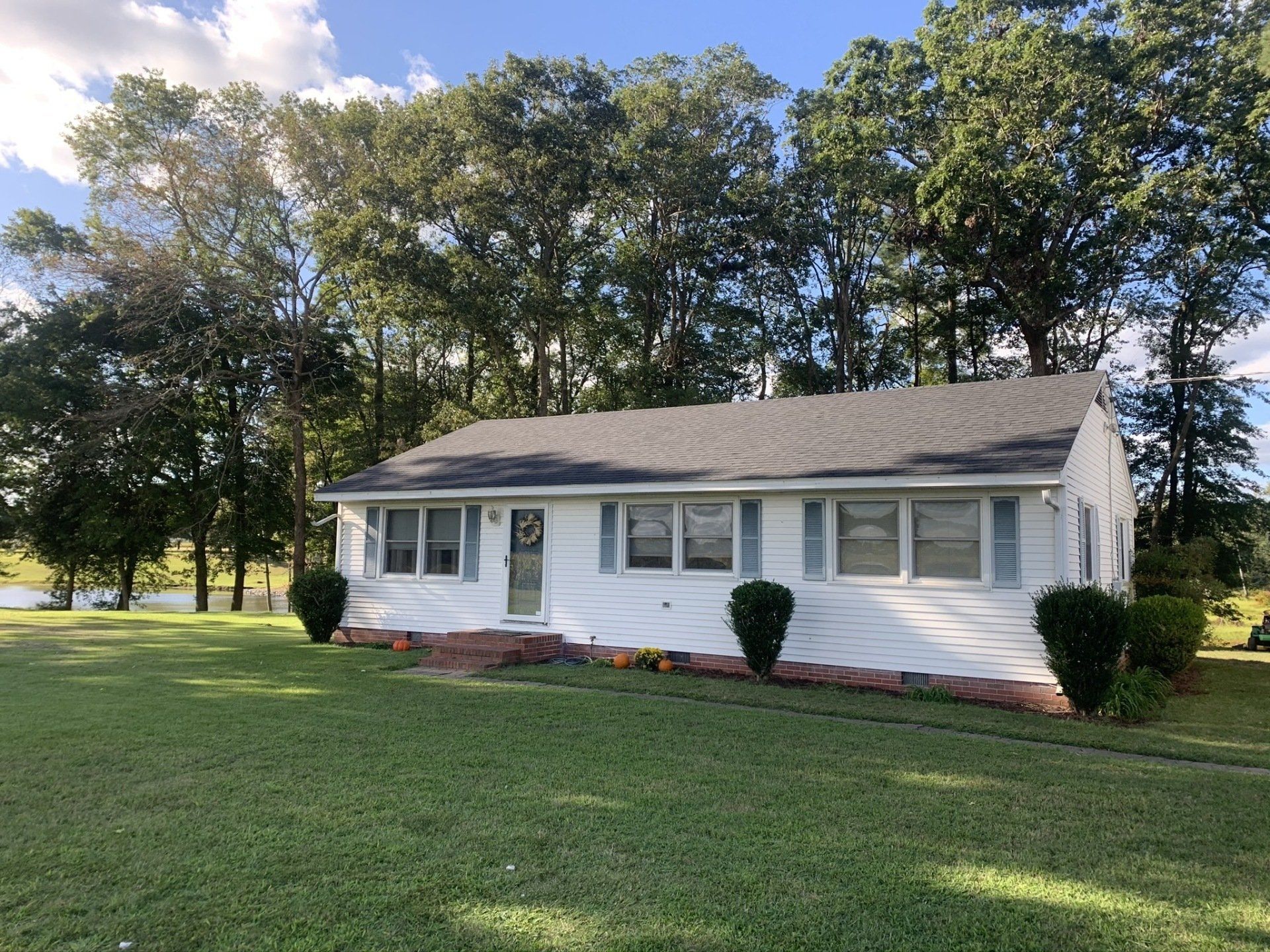 Bungalow House With White Siding — Millsboro, DE — Alpha Roofing & Siding