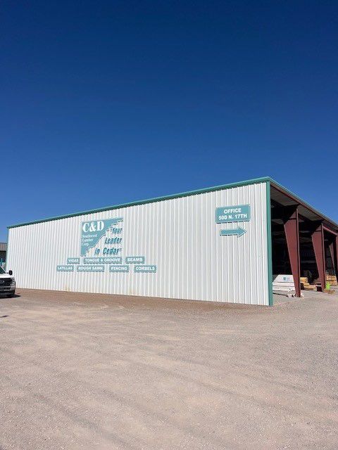 A car is parked in front of a building that says cap.