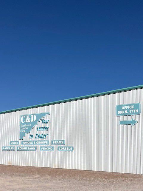 A building with a sign that says c & d on it.