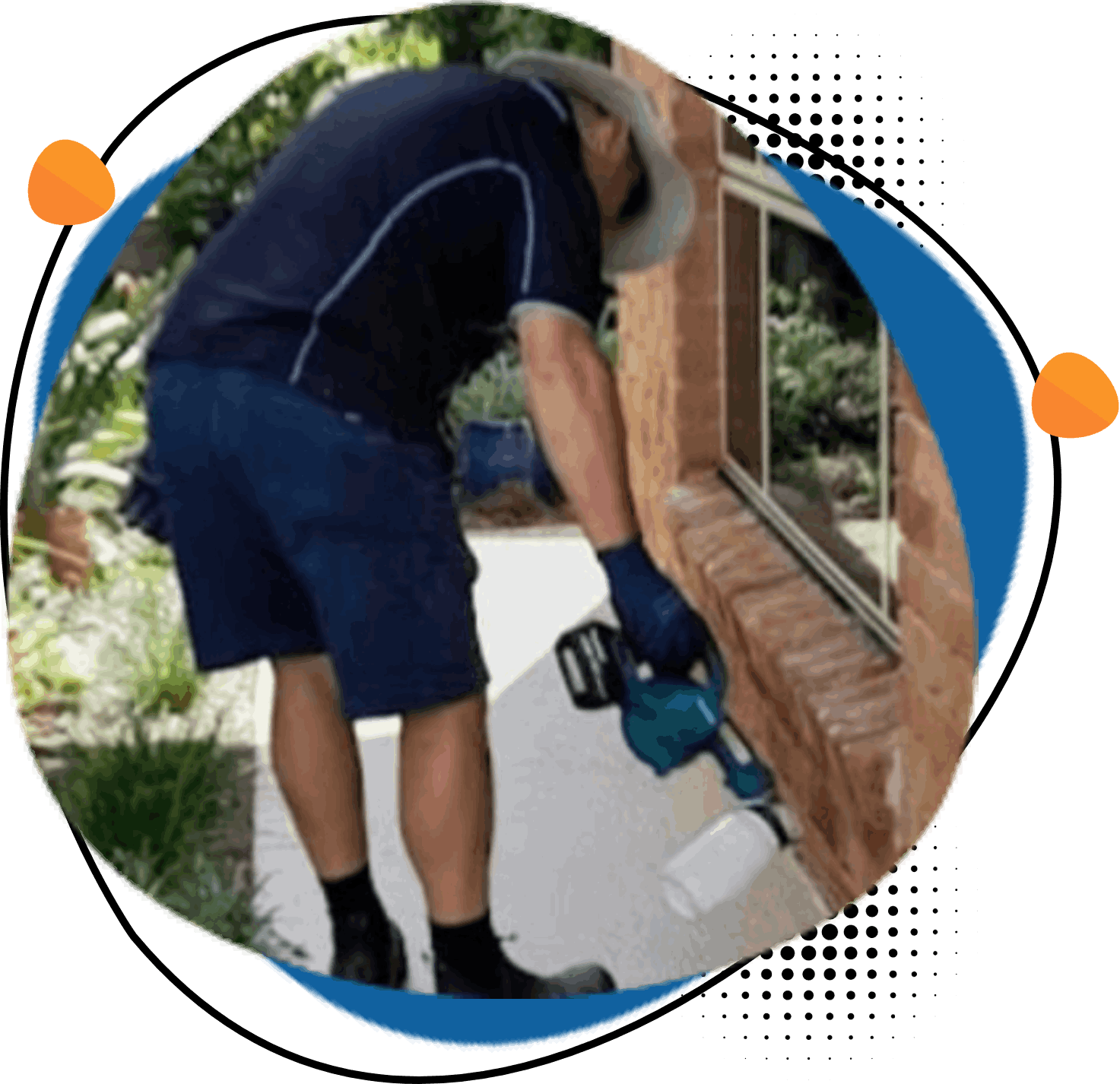 A man is working on a brick wall with a tool.