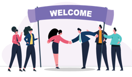 A group of people shaking hands under a welcome sign.