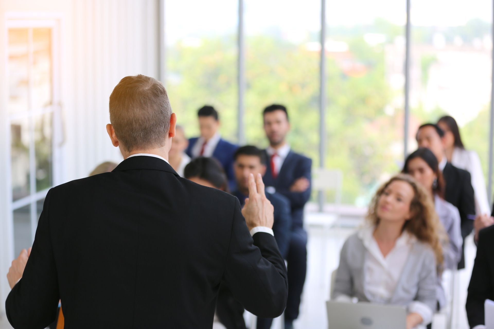 A man is giving a presentation to a group of people.