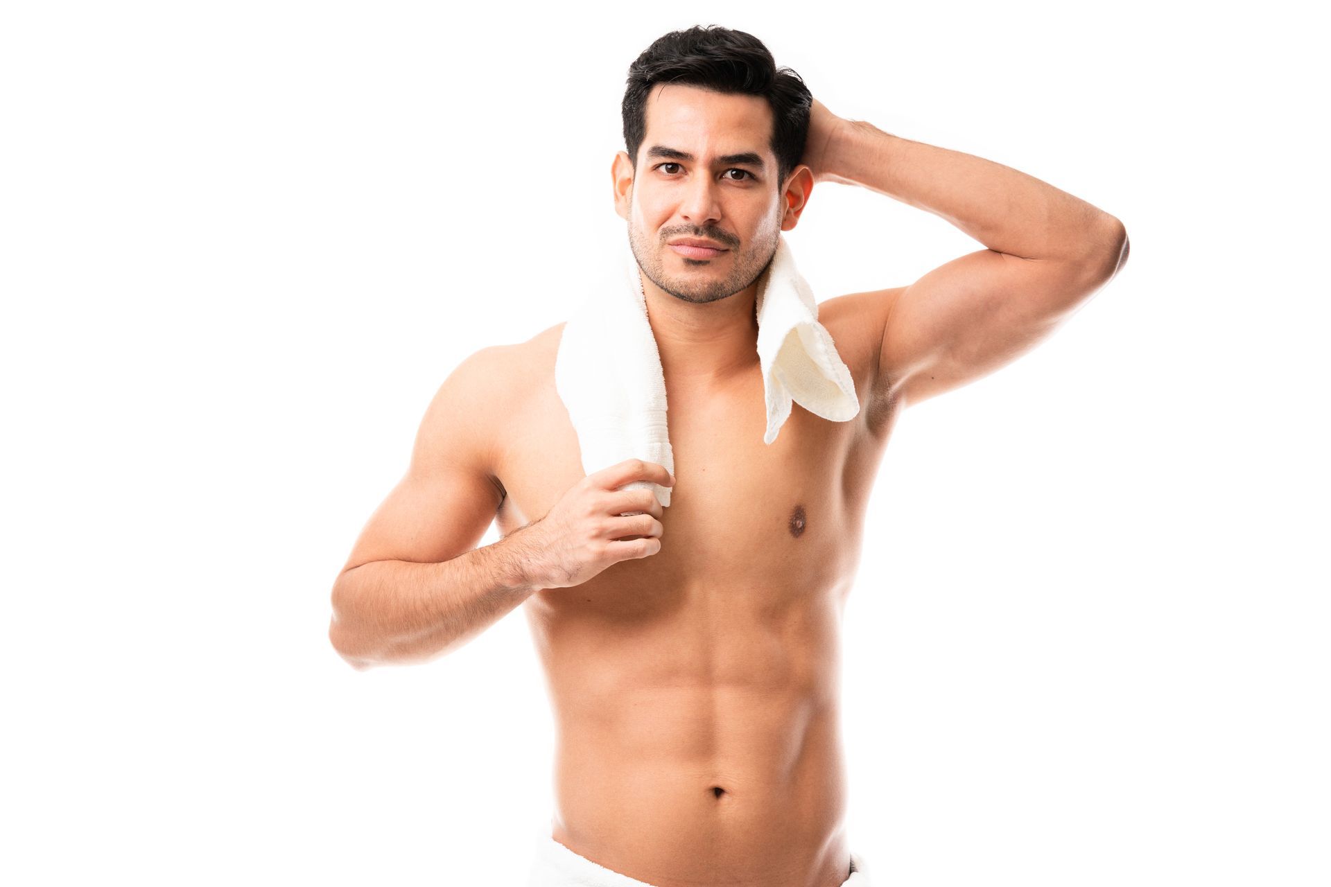 A shirtless man is holding a towel around his neck.