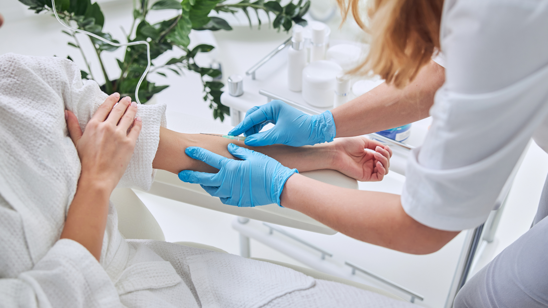 A woman is getting an injection in her arm by a doctor.
