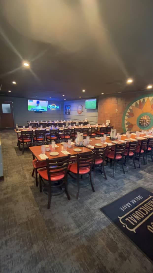 A large dining room filled with tables and chairs.