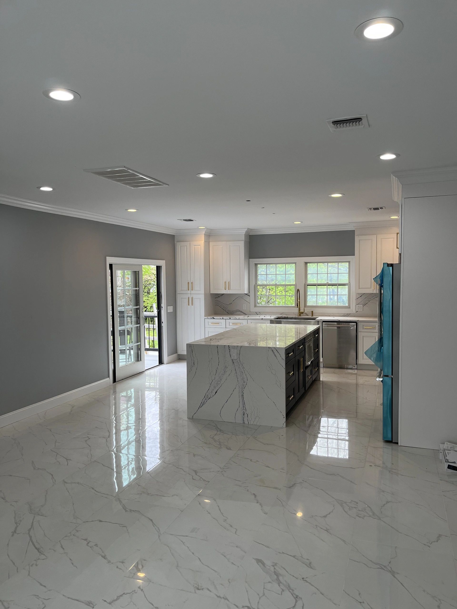 There is a large island in the middle of the kitchen.