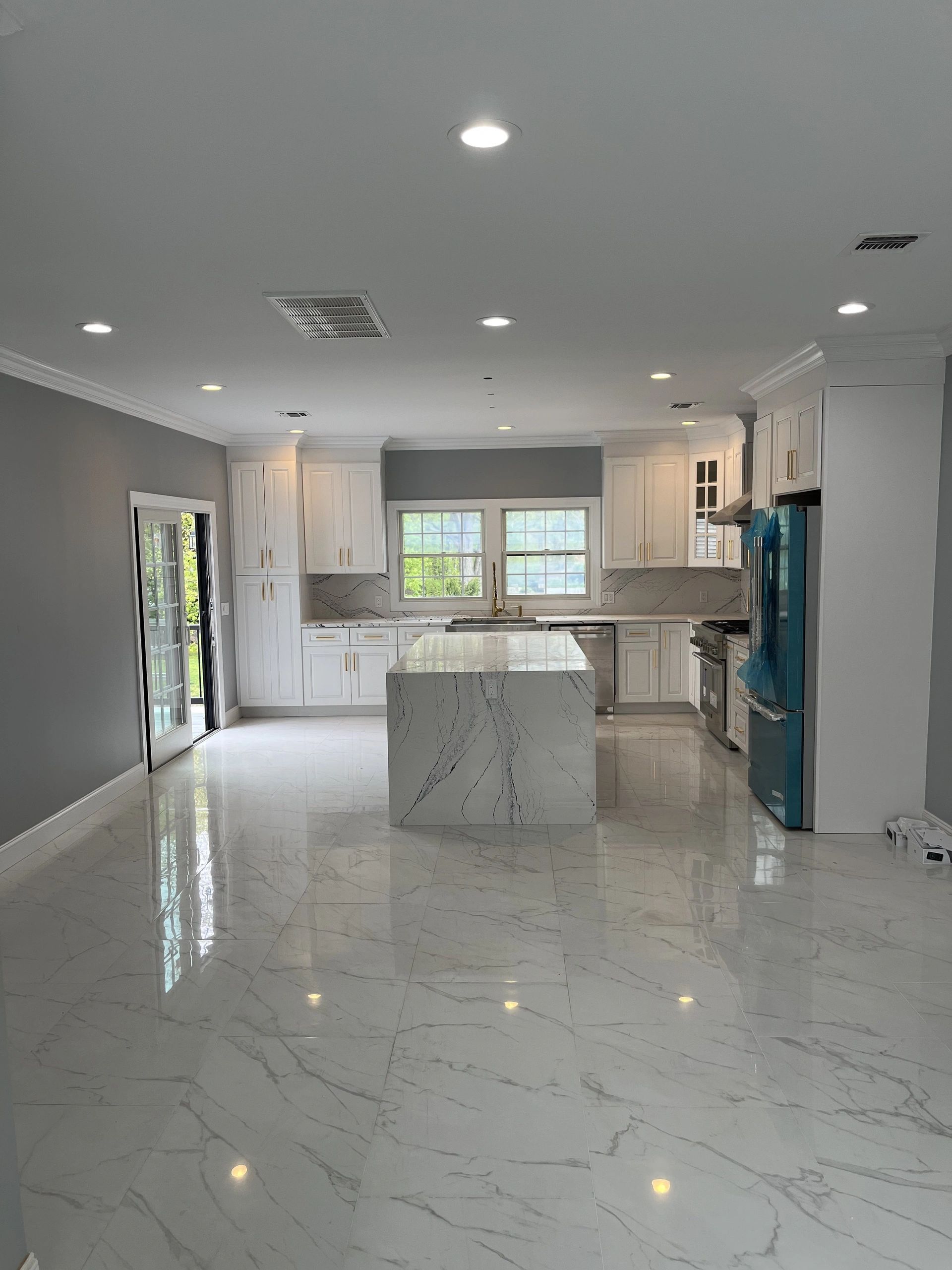 There is a large island in the middle of the kitchen.
