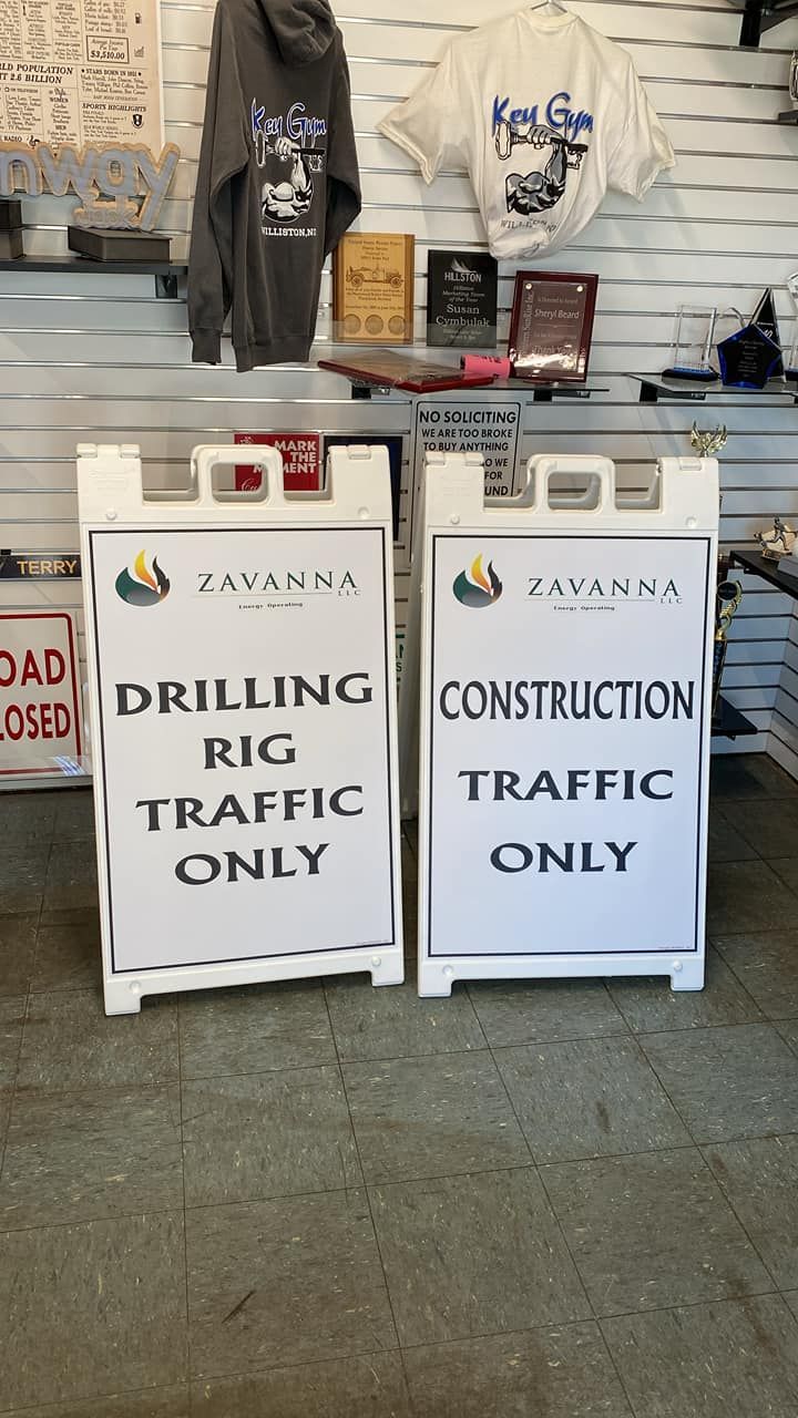 Two signs in a store that say drilling rig traffic only and construction traffic only.