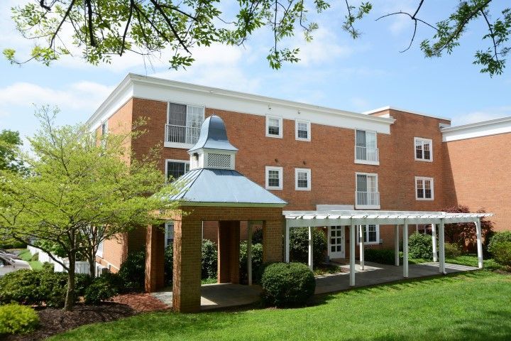 A large brick building with a gazebo in front of it.