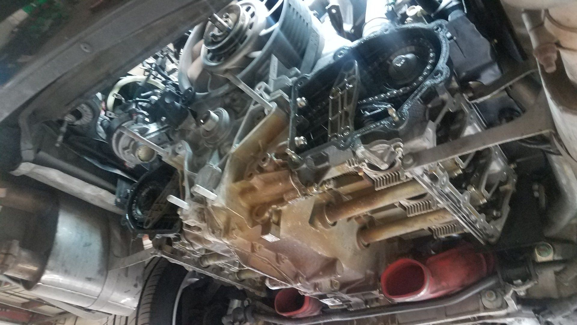 A close up of the underside of a car engine