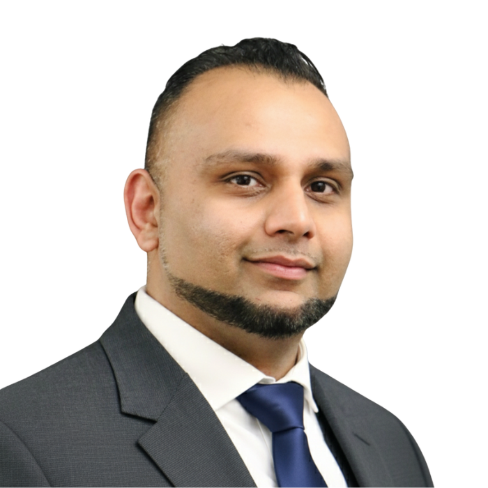 Man in a suit, looking at the camera with a neutral expression.