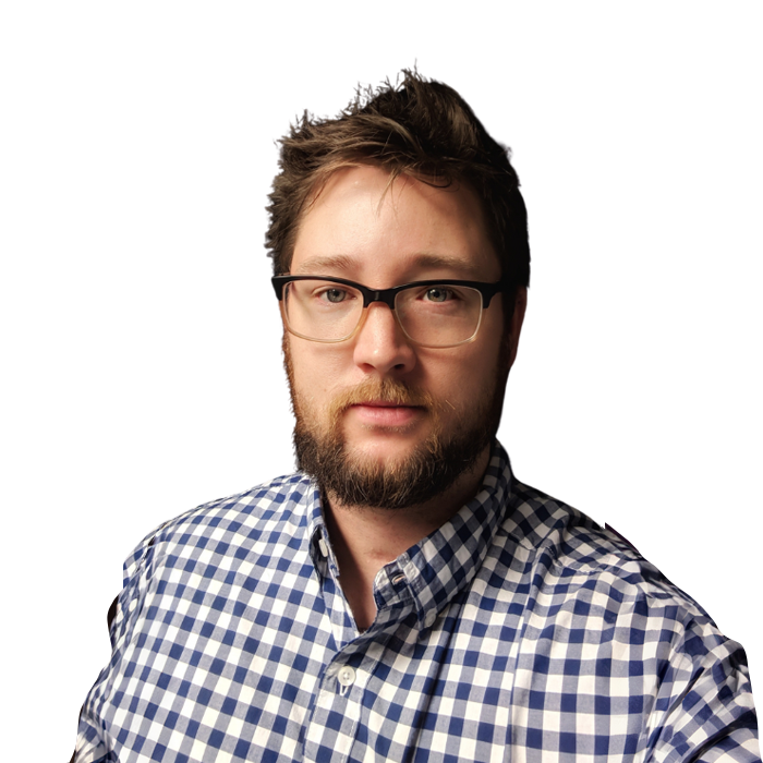 Man with glasses and a beard in a blue and white checkered shirt.