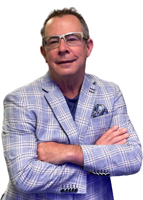 Man with glasses and arms crossed, wearing a blue plaid jacket and a blue shirt.
