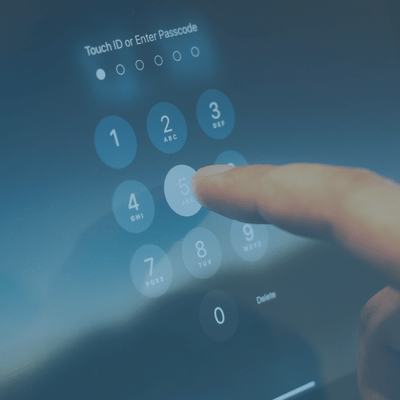 Finger tapping a glowing touchscreen passcode keypad 