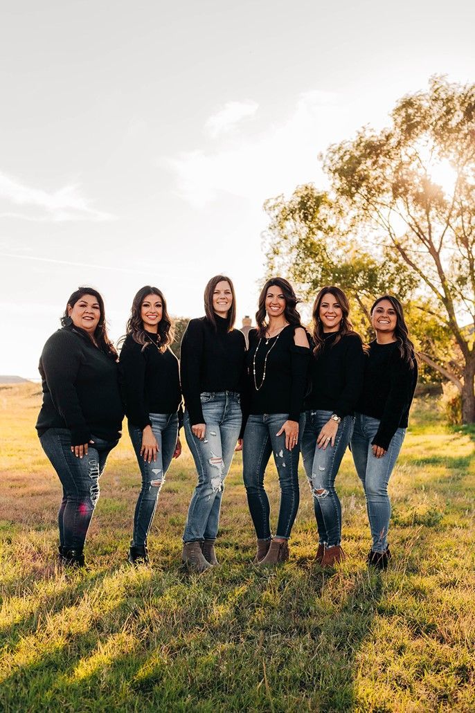 A Group of Women Standing Next to Each Other in a Field | Midland, TX | Sam Sowders