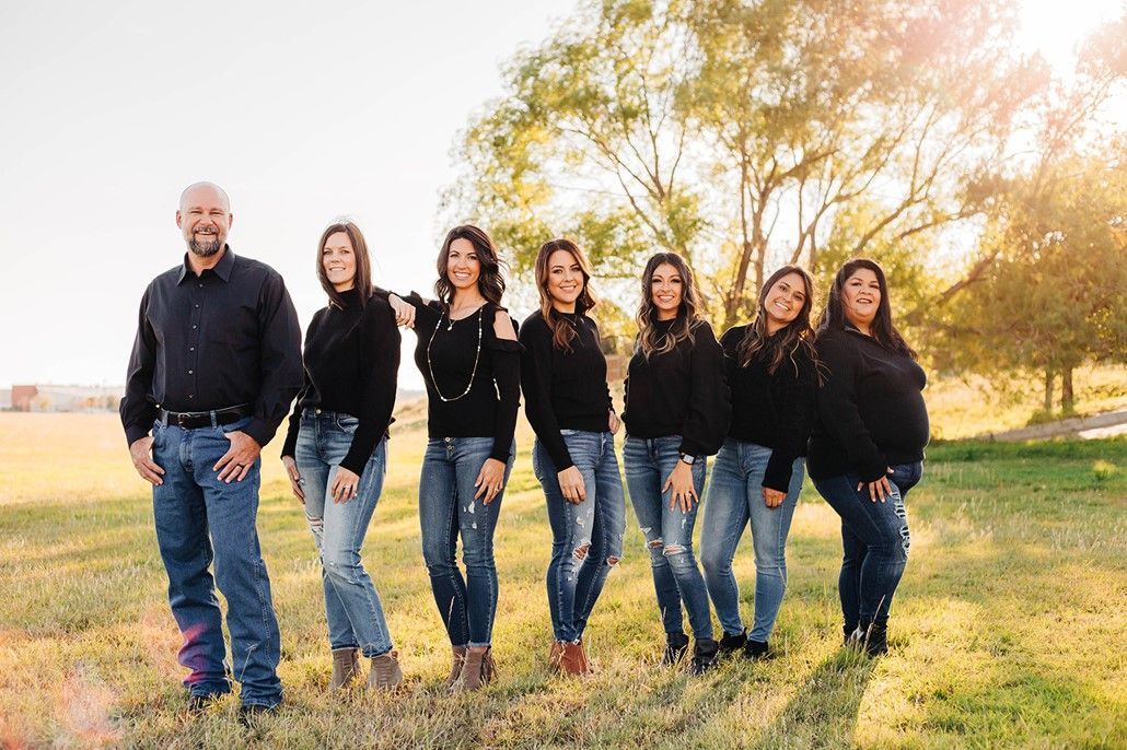 A Group of People Standing Next to Each Other in a Field | Midland, TX | Sam Sowders