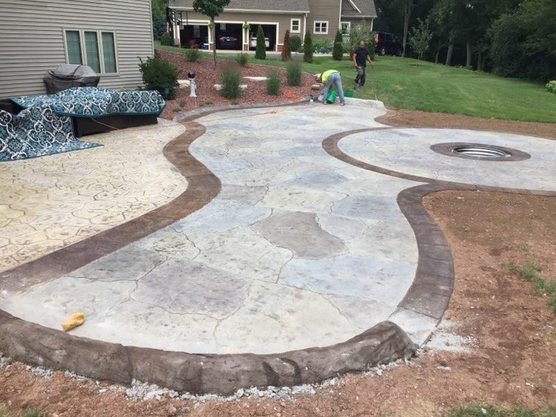 an elderly man is holding onto a stainless steel railing .
