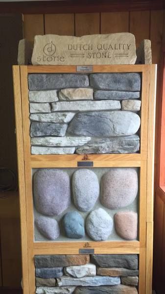Display of Dutch Quality stone samples in various colors and textures.