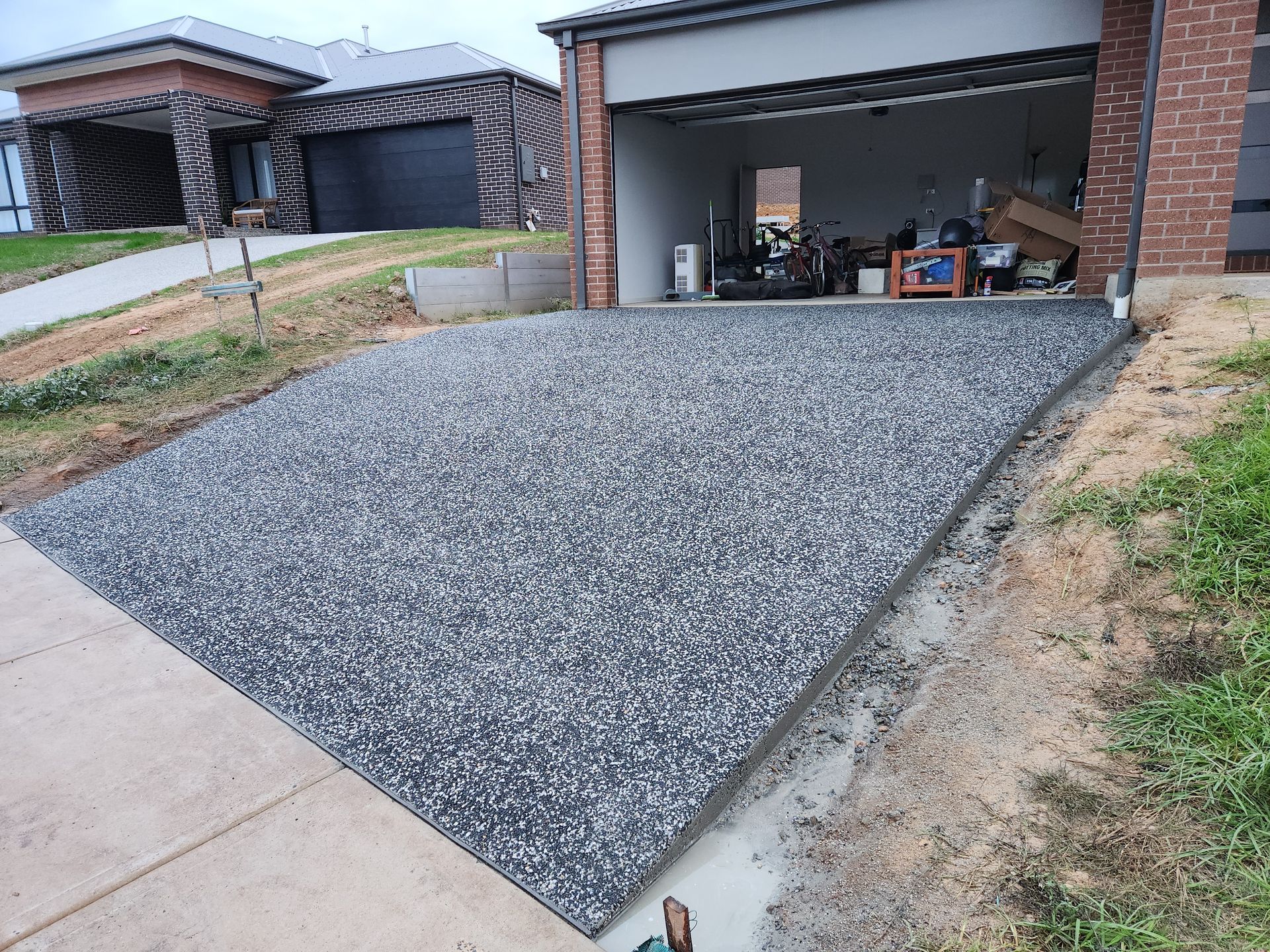 brand new exposed concrete driveway — Colombera Constructions In Wodonga, VIC