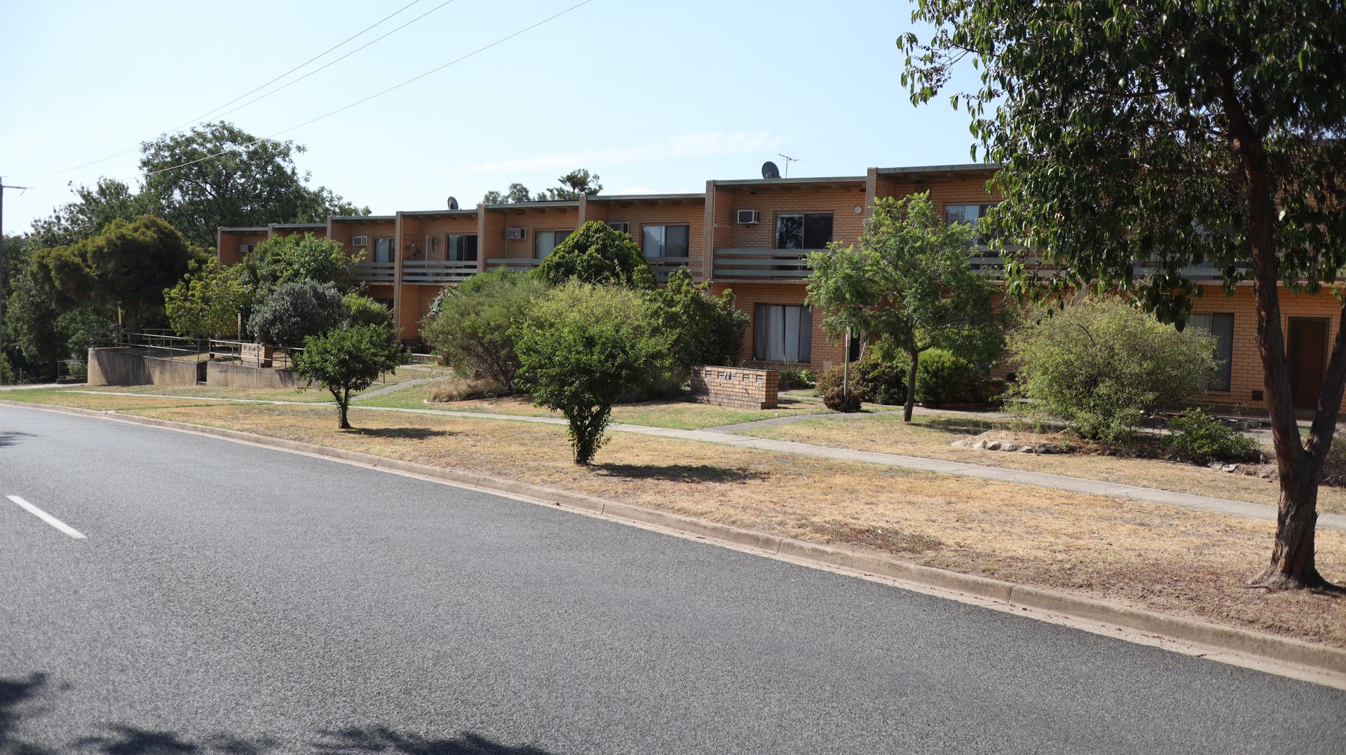 Units built with brick and tress around— Colombera Constructions In Wodonga, VIC